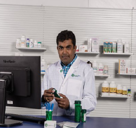 Ricker Pharmacy owner at the counter